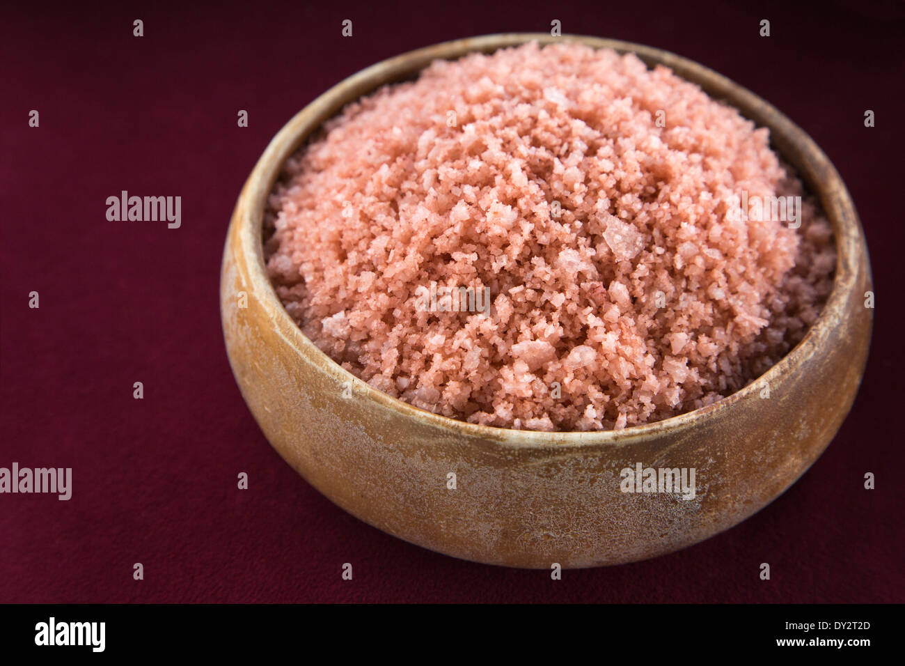 Pa`akai, sea salt harvested in Kauai by traditional methods. The red color is from iron oxide in clay blended with the salt. Stock Photo